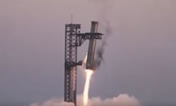 SpaceX Starship Booster Caught by Launch Gantry During Landing