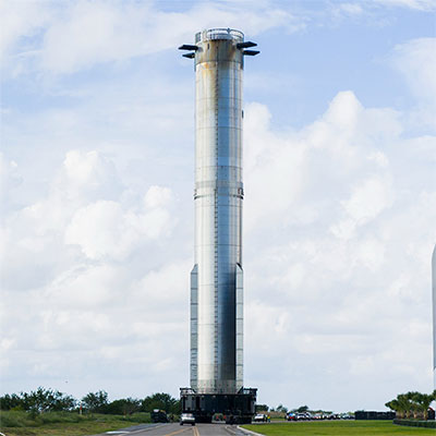 SpaceX Rolls Out Starship’s Super Heavy Booster in Preparation for Monday’s Scheduled Launch